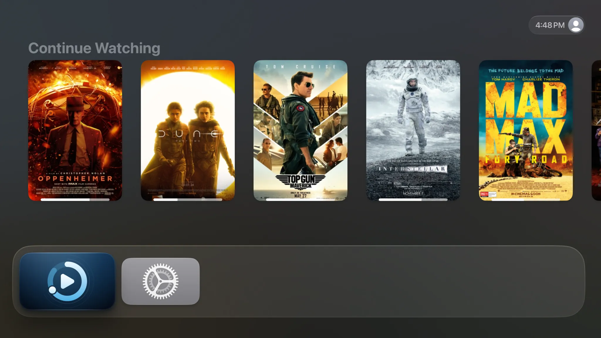 The Apple TV Home Screen with Spectati focused: Top Shelf shows Continue Watching posters for Oppenheimer, Dune: Part Two, Top Gun: Maverick, Interstellar and Mad Max: Fury Road, each with a progress bar