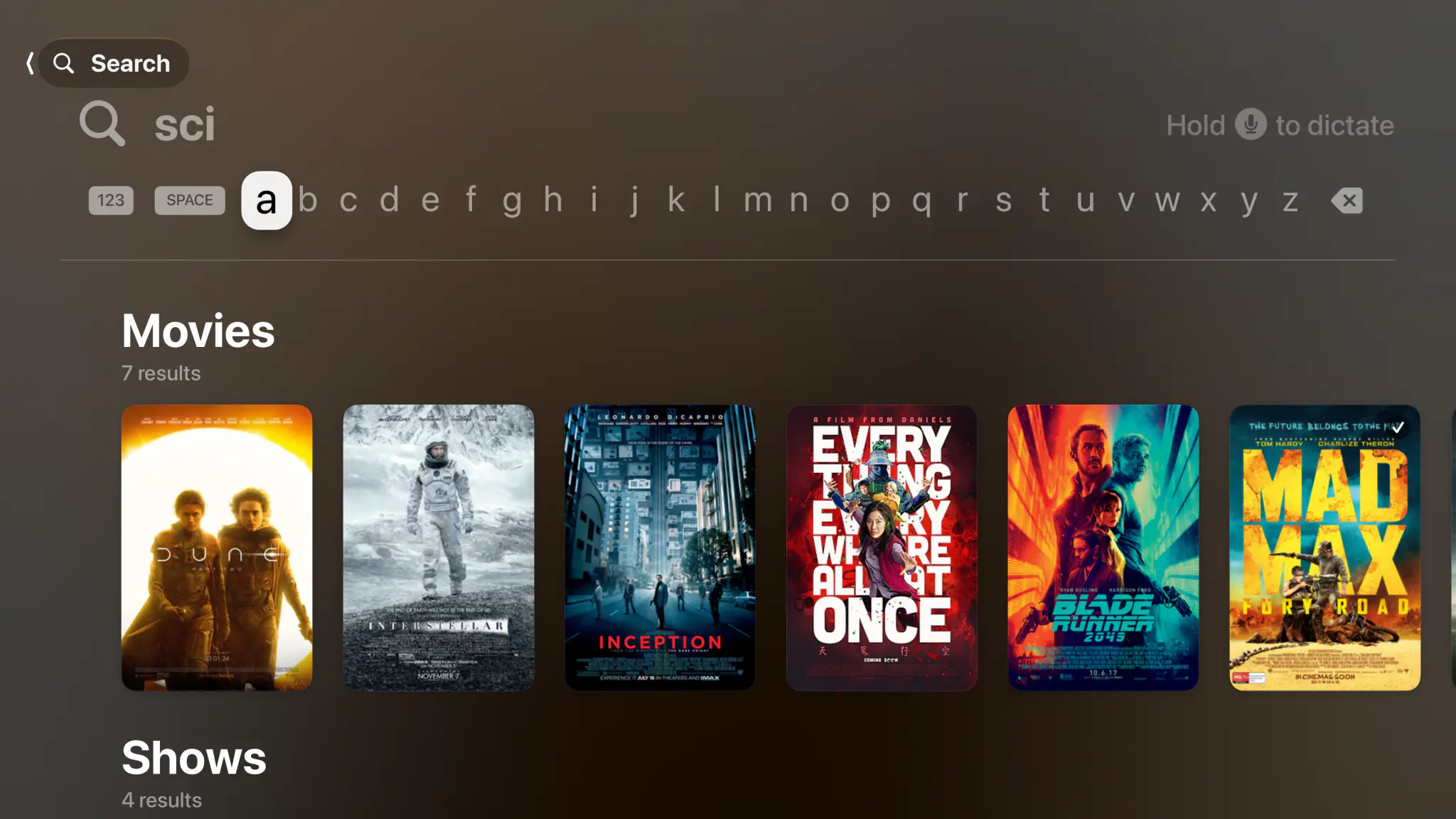 Search screen with a single-row keyboard and instant movie and show results for a two-letter query